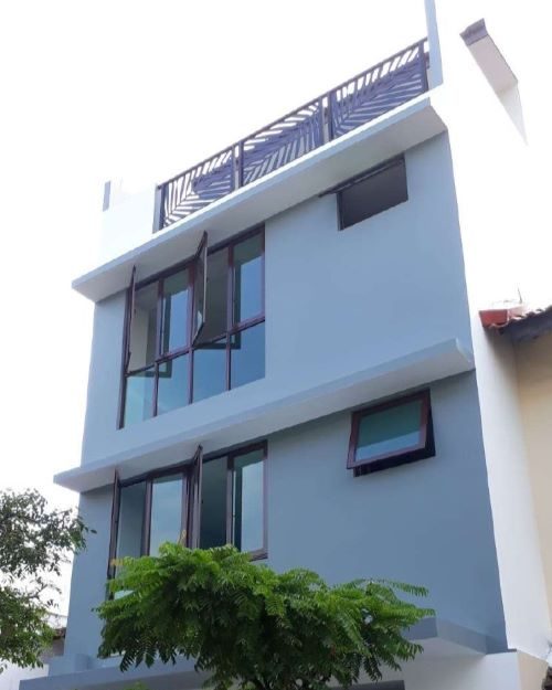 Side view of a house with windows open