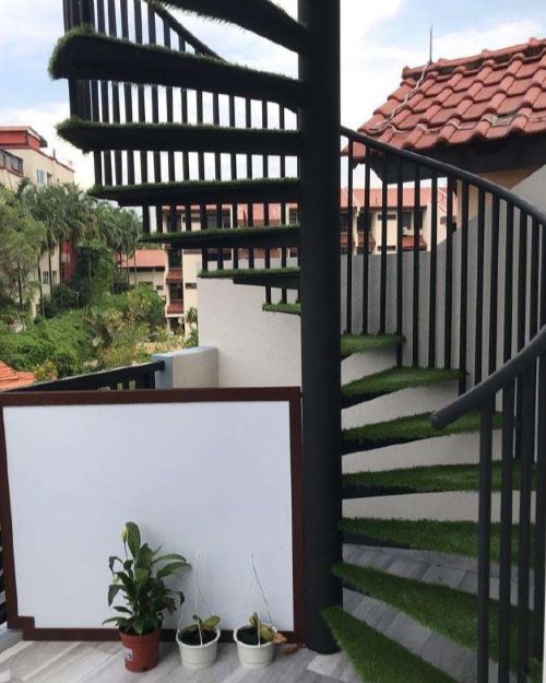 Staircase with carpet grass on each step of the staircase