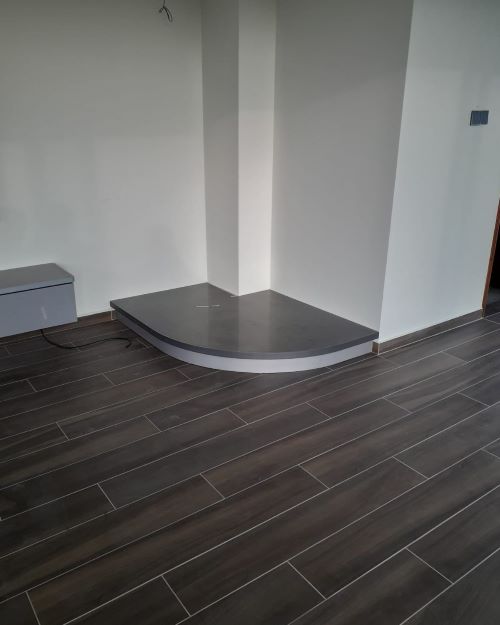Corner of a house with a rounded step