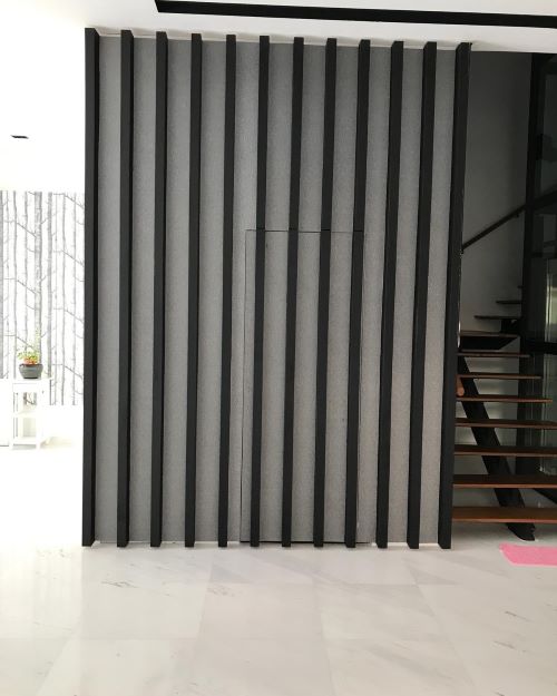 Decorative wall beside a staircase