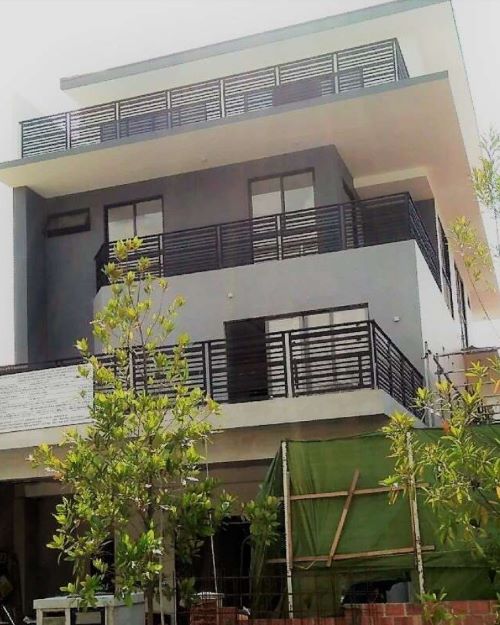 Side view of a house with multiple balconies